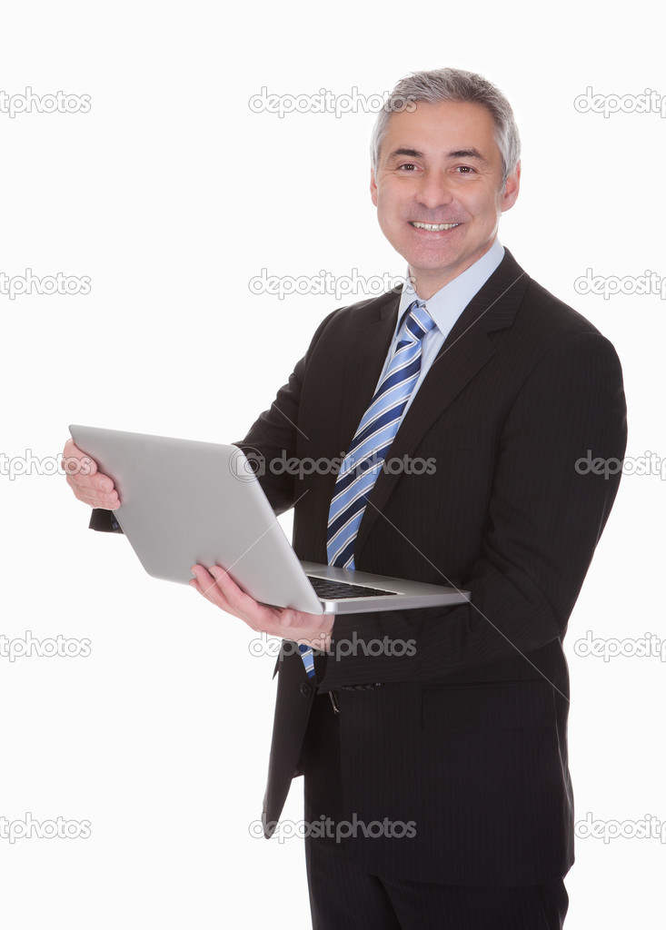 Happy Mature Businessman Using Laptop