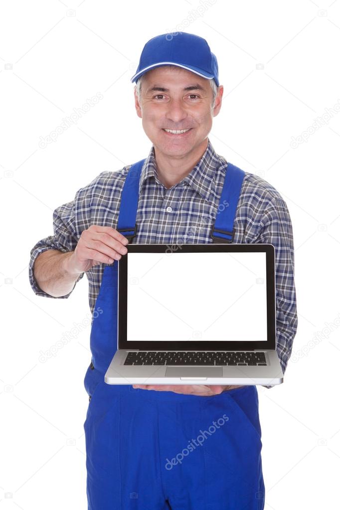 Mature Male Technician Showing Laptop