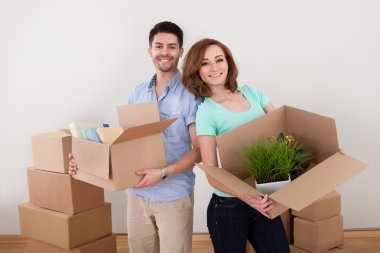 Young Couple Holding Cardbox