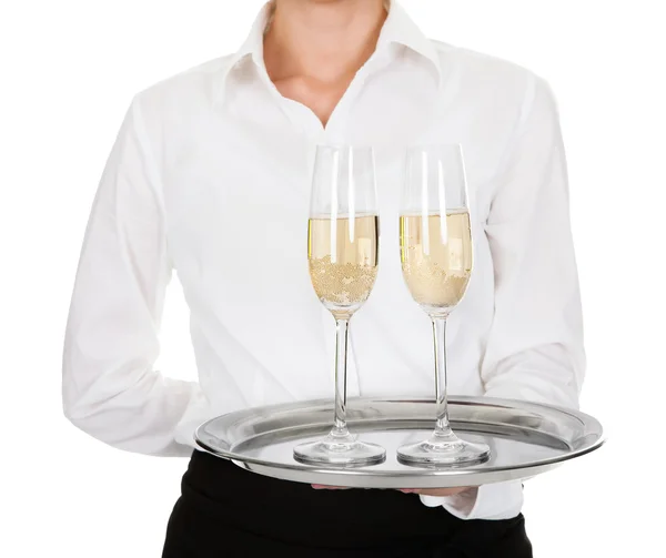 Camarera llevando una bandeja con copas de vino — Foto de Stock