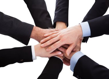 Business People Stacking Hand Over Each Other clipart