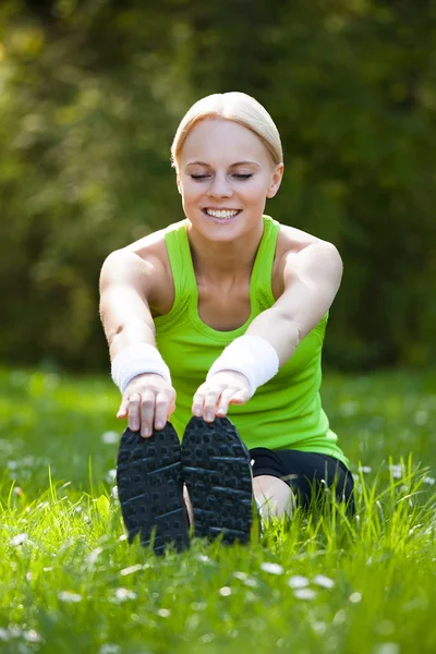 Young Happy Blonde Woman Stretching Leg — Stock Photo, Image