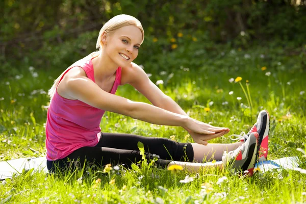 Happy Woman Stretching In Park — Stock Photo, Image