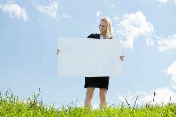 Businesswoman Holding Placard — Stock Photo, Image
