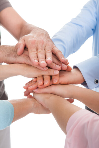 Close-up Of Hand Stacked Over Each Other
