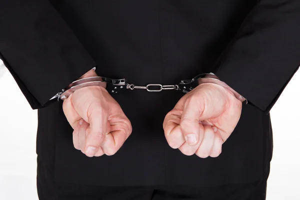 Close-up of arrested businessman Stock Photo