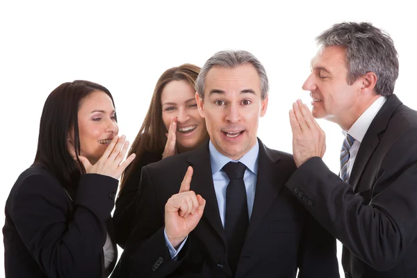 Group Of Businesspeople Gossiping Stock Image