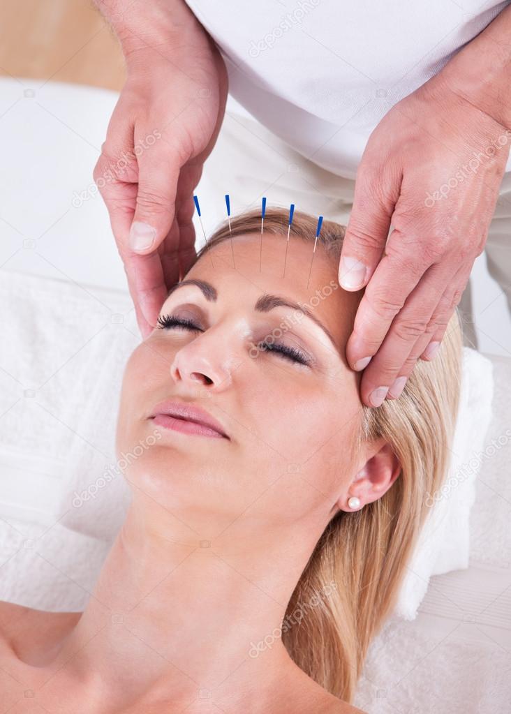 An Acupuncture Therapy In A Spa Center