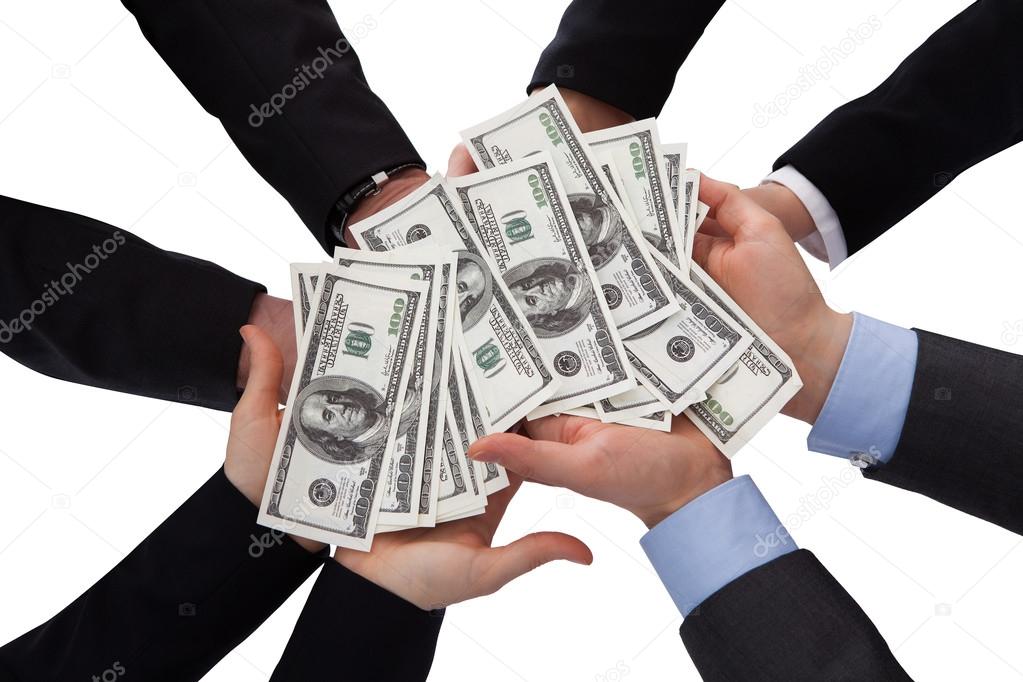 Group Of Businesspeople Holding Banknote