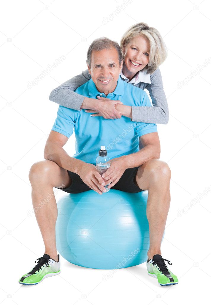Mature Couple On Pilates Ball