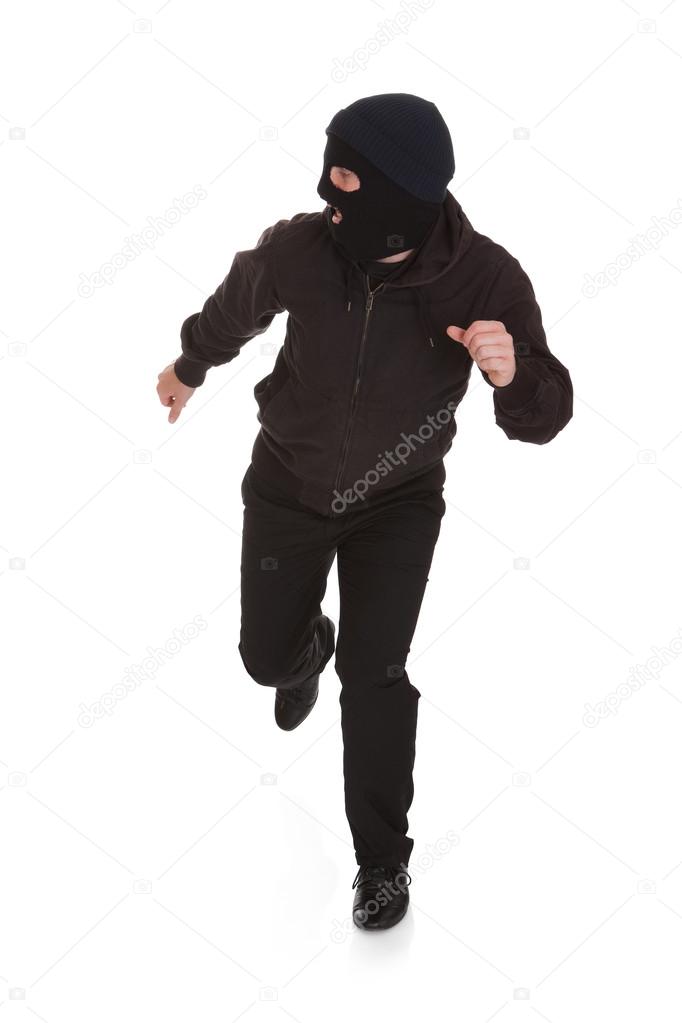 Bandit In Black Mask Running Away