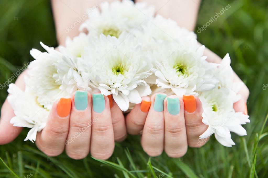 Close Up Of Woman's Hands Holding Flower