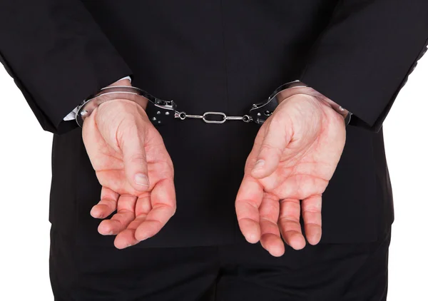 Close-up of arrested businessman — Stock Photo, Image