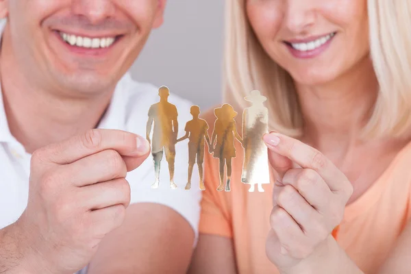 Paar bedrijf cut-out met familie figuur — Stockfoto