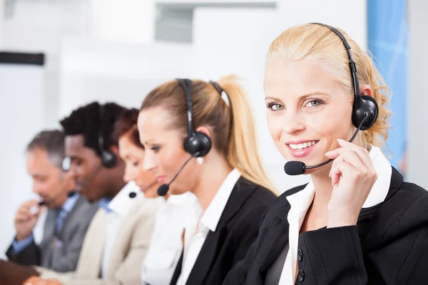 Beautiful Young Woman Talking On Headset — Stock Photo, Image