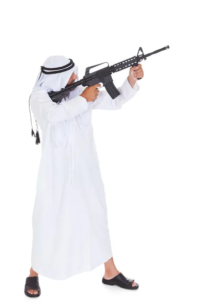 Szczęśliwy dojrzały mężczyzna islamskich, trzymając pistolet — Zdjęcie stockowe