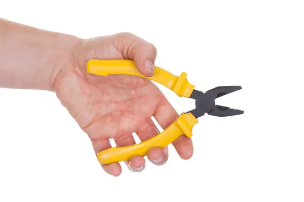 Hand holding plier met gele grepen — Stockfoto