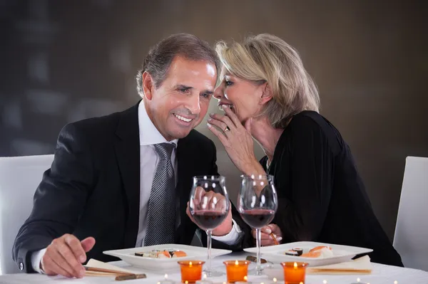 Cheerful Woman Whispering In Man's Ear — Stock Photo, Image