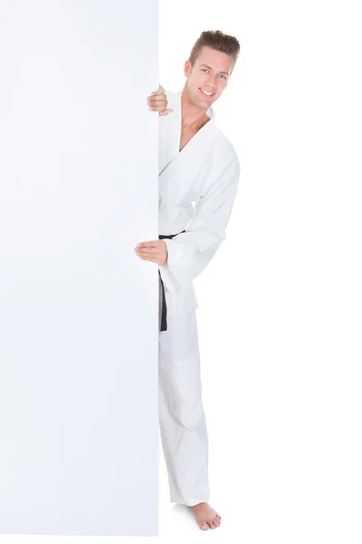 Young Man In Kimono Holding Placard — Stock Photo, Image