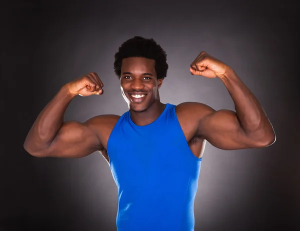 African Man Showing Muscle — Stock Photo, Image