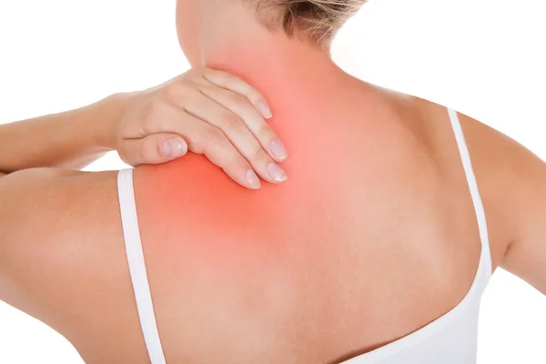 Kvinna som har ont i ryggen — Stockfoto