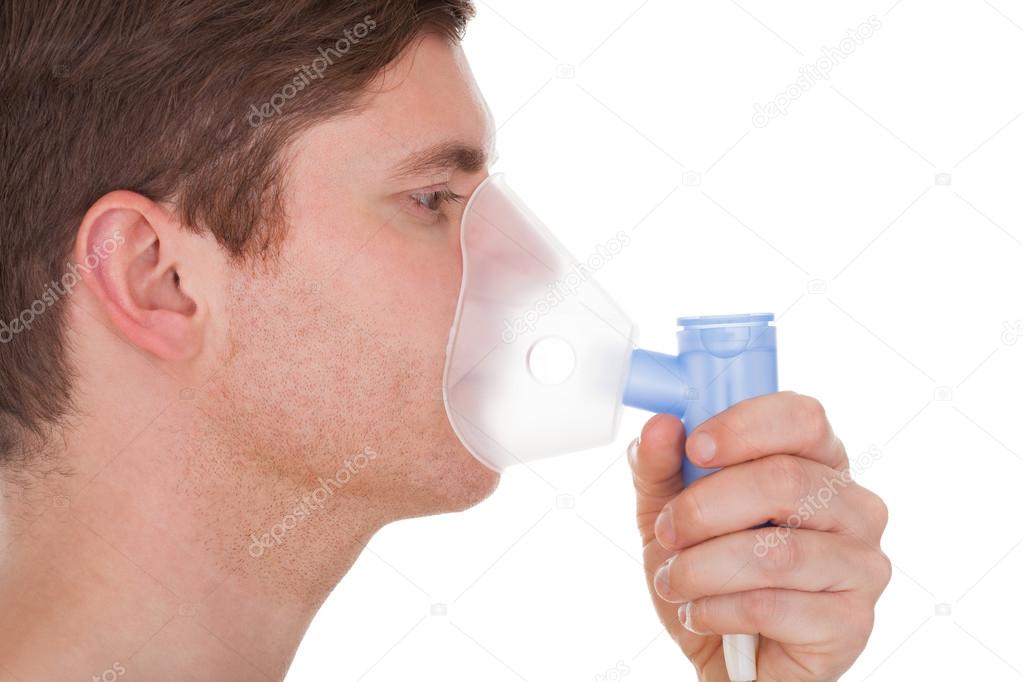 Young Man Wearing Oxygen Mask