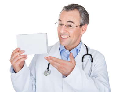 Doctor holding prescription note