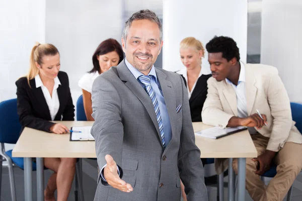 Mature Businessman Offering Handshake — Stock Photo, Image