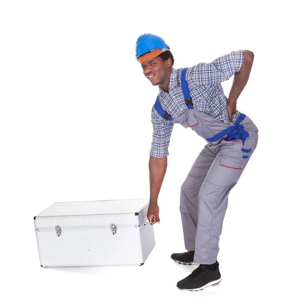 Man With Back Pain Lifting Metal Box — Stock Photo, Image