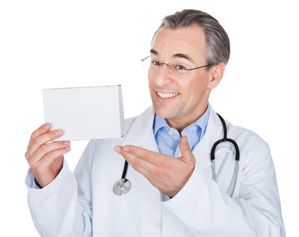 Doctor holding prescription note — Stok fotoğraf