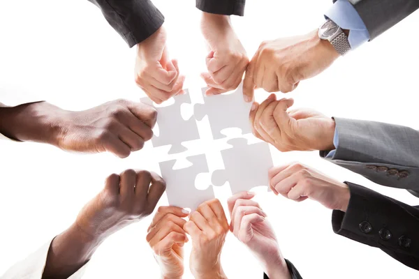 Businesspeople Holding Jigsaw Puzzle — Stock Photo, Image