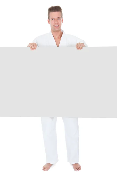 Young Man In Kimono Holding Placard — Stock Photo, Image