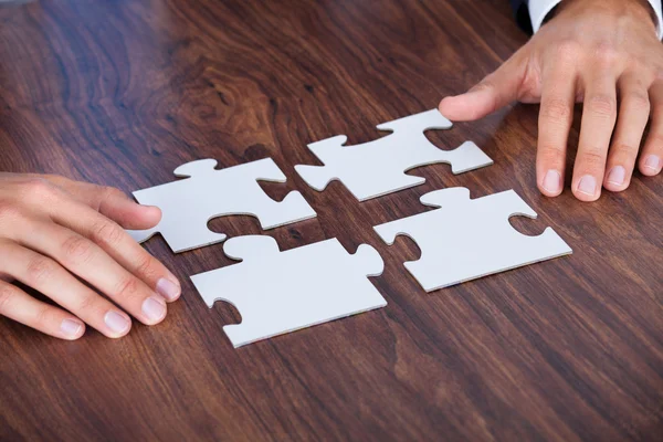 Businessman Holding Jigsaw Puzzle — Stock Photo, Image