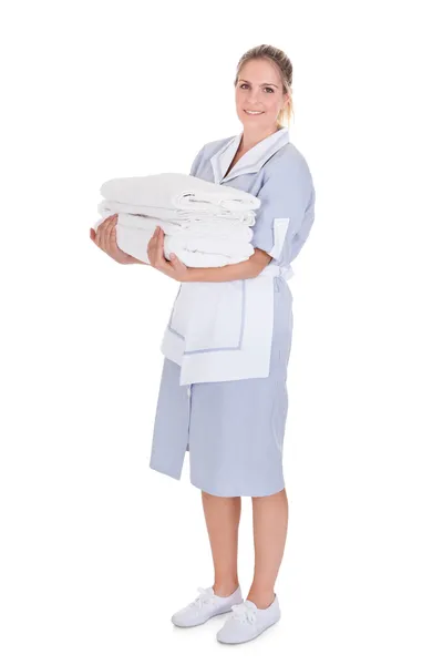 Happy Young Maid Holding Towels — Stock Photo, Image