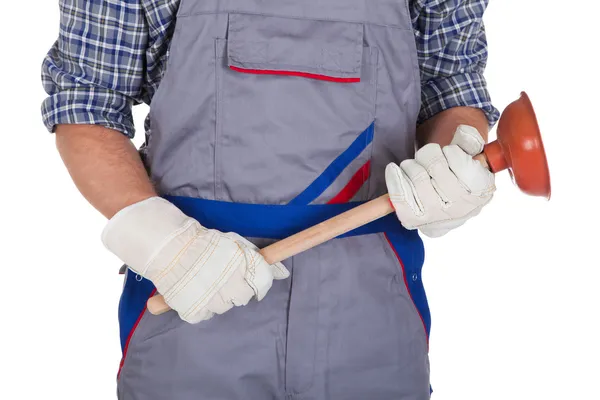 Happy plumber holding plunger — Stock Photo, Image