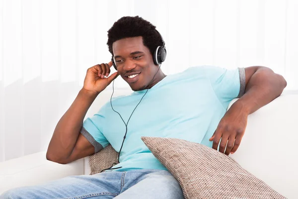 Young Man Listening On Headphone