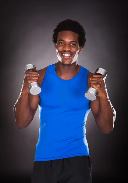 Young Man Holding Dumbbell — Stock Photo, Image