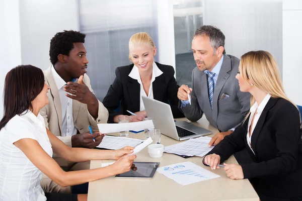 Group Of Businesspeople Discussing Together Royalty Free Stock Images