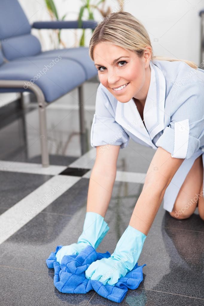 Young Maid Cleaning The Floor