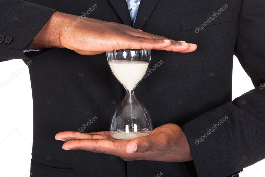 Businessman Holding Hourglass