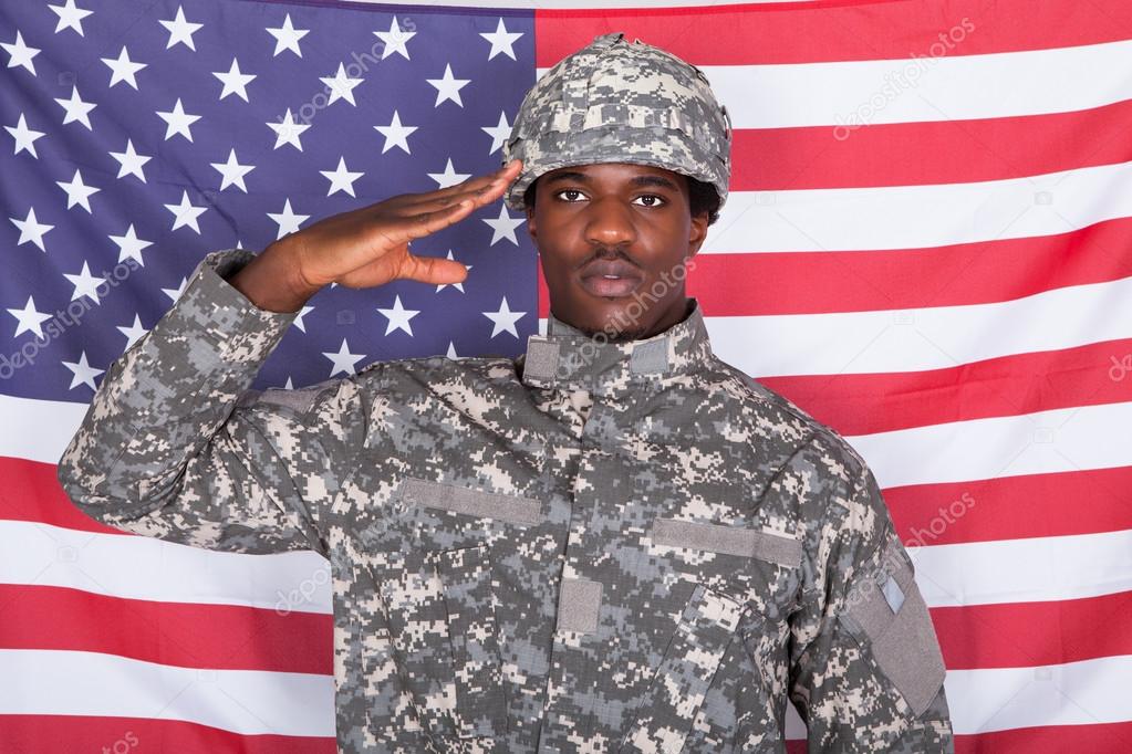 Army Soldier Saluting In Front Of American Flag