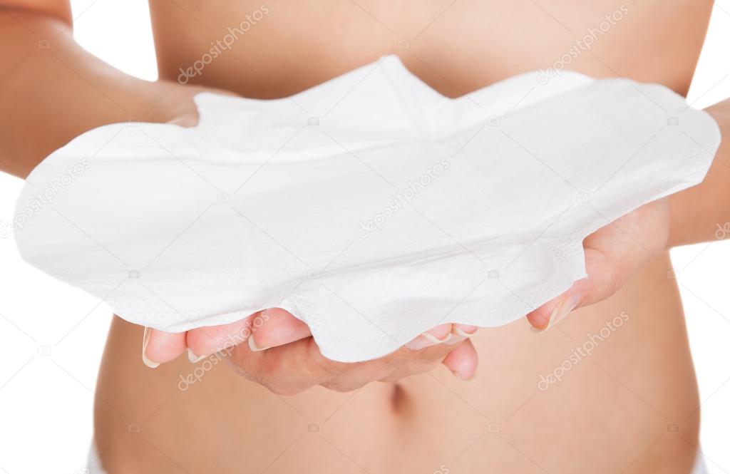 Woman holding sanitary pad