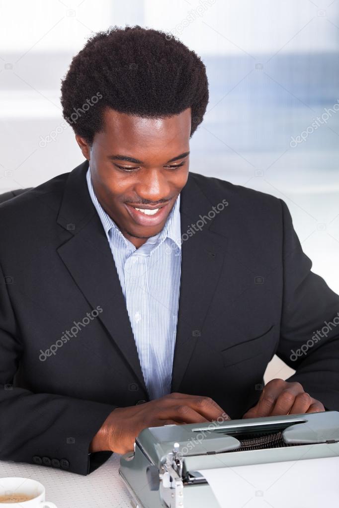 Businessman Typing On Typewriter