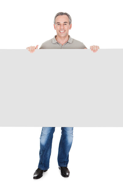 Happy Mature Man Standing and Placard
