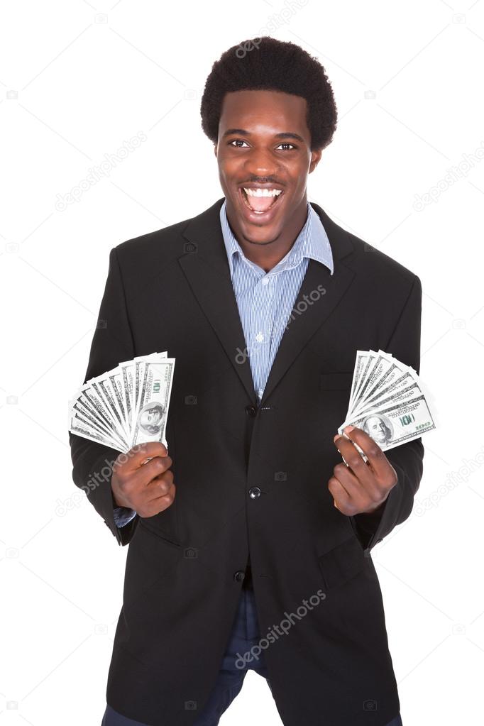 Excited Businessman Holding Dollar Currency