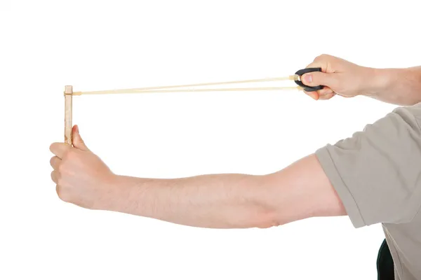 Close-up of hand pulling sling shot — Stock Photo, Image