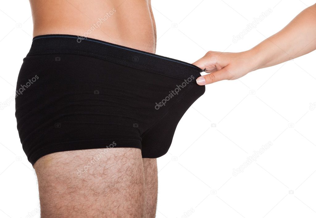 Woman holding man's underwear Stock Photo by ©AndreyPopov 30907767