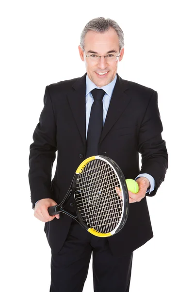 Empresario con raqueta y pelota — Foto de Stock