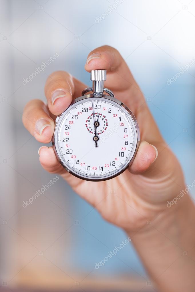 Stopwatch In Female Hand