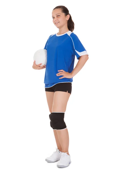 Happy female volleyball player holding ball — Stock Photo, Image